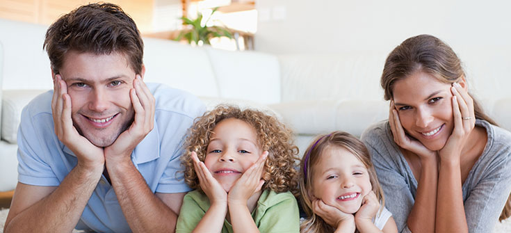 Family lying on a carpet